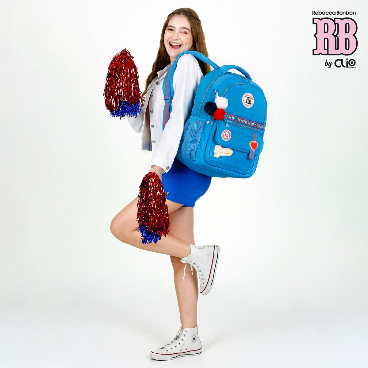 Mochila escolar Rebecca Bonbon con pompones y parches